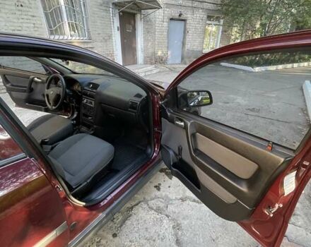 Красный Опель Астра, объемом двигателя 1.4 л и пробегом 177 тыс. км за 4600 $, фото 16 на Automoto.ua