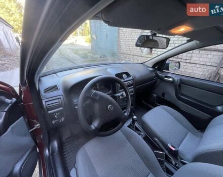 Красный Опель Астра, объемом двигателя 1.4 л и пробегом 177 тыс. км за 4600 $, фото 19 на Automoto.ua