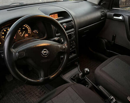 Красный Опель Астра, объемом двигателя 1.39 л и пробегом 187 тыс. км за 4800 $, фото 6 на Automoto.ua