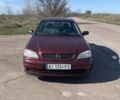 Красный Опель Астра, объемом двигателя 1.6 л и пробегом 300 тыс. км за 3300 $, фото 1 на Automoto.ua