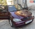 Красный Опель Астра, объемом двигателя 1.4 л и пробегом 177 тыс. км за 4600 $, фото 12 на Automoto.ua