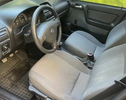 Красный Опель Астра, объемом двигателя 1.4 л и пробегом 177 тыс. км за 4600 $, фото 23 на Automoto.ua