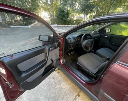 Красный Опель Астра, объемом двигателя 1.4 л и пробегом 177 тыс. км за 4600 $, фото 15 на Automoto.ua