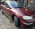 Красный Опель Астра, объемом двигателя 1.4 л и пробегом 285 тыс. км за 3100 $, фото 3 на Automoto.ua