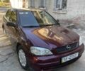 Красный Опель Астра, объемом двигателя 1.4 л и пробегом 177 тыс. км за 4600 $, фото 2 на Automoto.ua