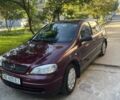 Красный Опель Астра, объемом двигателя 1.4 л и пробегом 177 тыс. км за 4600 $, фото 3 на Automoto.ua