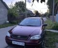 Красный Опель Астра, объемом двигателя 1.6 л и пробегом 160 тыс. км за 4300 $, фото 1 на Automoto.ua