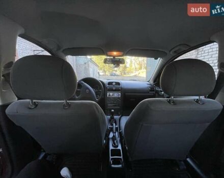 Красный Опель Астра, объемом двигателя 1.4 л и пробегом 177 тыс. км за 4600 $, фото 33 на Automoto.ua