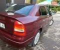 Красный Опель Астра, объемом двигателя 1.4 л и пробегом 285 тыс. км за 3100 $, фото 1 на Automoto.ua