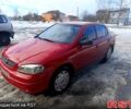 Красный Опель Астра, объемом двигателя 1.4 л и пробегом 199 тыс. км за 4150 $, фото 1 на Automoto.ua