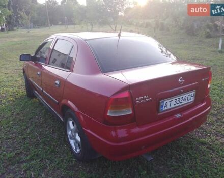 Червоний Опель Астра, об'ємом двигуна 1.6 л та пробігом 220 тис. км за 3900 $, фото 9 на Automoto.ua
