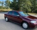 Красный Опель Астра, объемом двигателя 1.36 л и пробегом 200 тыс. км за 4000 $, фото 1 на Automoto.ua
