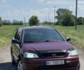 Червоний Опель Астра, об'ємом двигуна 1.6 л та пробігом 183 тис. км за 4500 $, фото 1 на Automoto.ua