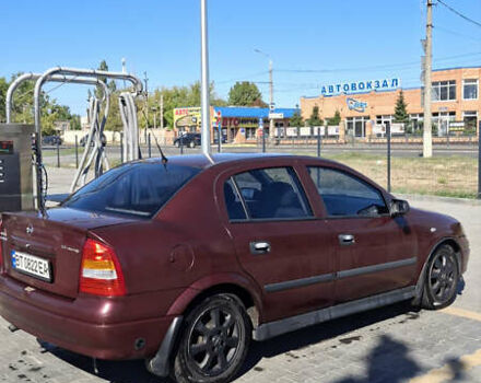 Красный Опель Астра, объемом двигателя 1.4 л и пробегом 229 тыс. км за 4900 $, фото 2 на Automoto.ua