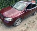 Красный Опель Астра, объемом двигателя 1.38 л и пробегом 290 тыс. км за 1900 $, фото 1 на Automoto.ua