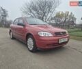 Красный Опель Астра, объемом двигателя 1.4 л и пробегом 233 тыс. км за 3800 $, фото 1 на Automoto.ua