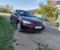 Красный Опель Астра, объемом двигателя 1.39 л и пробегом 195 тыс. км за 2200 $, фото 1 на Automoto.ua