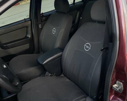Красный Опель Астра, объемом двигателя 1.36 л и пробегом 173 тыс. км за 4800 $, фото 17 на Automoto.ua