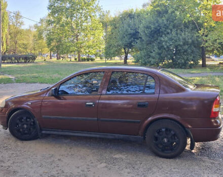 Красный Опель Астра, объемом двигателя 1.4 л и пробегом 229 тыс. км за 4900 $, фото 1 на Automoto.ua