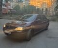 Красный Опель Астра, объемом двигателя 1.4 л и пробегом 190 тыс. км за 2200 $, фото 1 на Automoto.ua