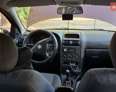 Красный Опель Астра, объемом двигателя 1.4 л и пробегом 229 тыс. км за 4900 $, фото 6 на Automoto.ua