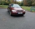 Красный Опель Астра, объемом двигателя 1.6 л и пробегом 234 тыс. км за 3800 $, фото 1 на Automoto.ua