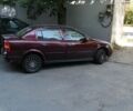 Красный Опель Астра, объемом двигателя 1.36 л и пробегом 240 тыс. км за 2990 $, фото 1 на Automoto.ua