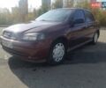 Красный Опель Астра, объемом двигателя 1.4 л и пробегом 320 тыс. км за 3450 $, фото 1 на Automoto.ua