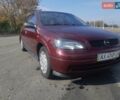 Красный Опель Астра, объемом двигателя 1.4 л и пробегом 320 тыс. км за 3450 $, фото 1 на Automoto.ua