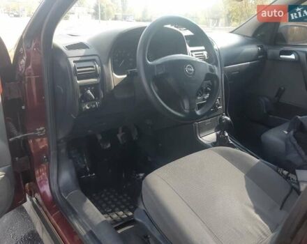 Красный Опель Астра, объемом двигателя 1.4 л и пробегом 320 тыс. км за 3450 $, фото 3 на Automoto.ua