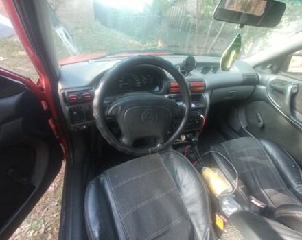 Красный Опель Астра, объемом двигателя 1.6 л и пробегом 300 тыс. км за 1000 $, фото 6 на Automoto.ua