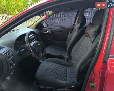 Красный Опель Астра, объемом двигателя 1.6 л и пробегом 310 тыс. км за 3200 $, фото 2 на Automoto.ua