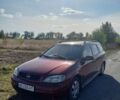 Красный Опель Астра, объемом двигателя 1.4 л и пробегом 290 тыс. км за 2200 $, фото 1 на Automoto.ua