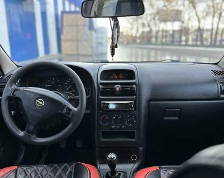 Красный Опель Астра, объемом двигателя 2 л и пробегом 250 тыс. км за 2699 $, фото 9 на Automoto.ua