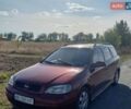 Красный Опель Астра, объемом двигателя 1.4 л и пробегом 290 тыс. км за 2200 $, фото 1 на Automoto.ua
