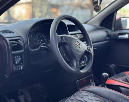 Красный Опель Астра, объемом двигателя 2 л и пробегом 250 тыс. км за 2699 $, фото 7 на Automoto.ua