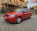 Красный Опель Астра, объемом двигателя 1.6 л и пробегом 239 тыс. км за 2350 $, фото 1 на Automoto.ua