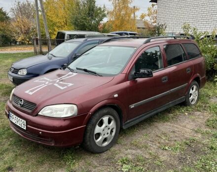 Красный Опель Астра, объемом двигателя 2 л и пробегом 200 тыс. км за 650 $, фото 2 на Automoto.ua