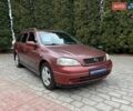 Красный Опель Астра, объемом двигателя 1.6 л и пробегом 266 тыс. км за 4000 $, фото 1 на Automoto.ua