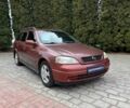 Красный Опель Астра, объемом двигателя 1.6 л и пробегом 266 тыс. км за 3800 $, фото 1 на Automoto.ua