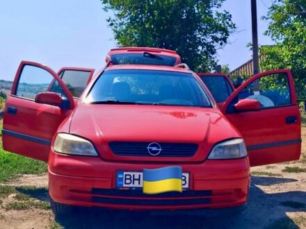 Красный Опель Астра, объемом двигателя 2 л и пробегом 310 тыс. км за 3450 $, фото 1 на Automoto.ua