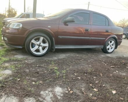 Красный Опель Астра, объемом двигателя 1.6 л и пробегом 270 тыс. км за 4000 $, фото 1 на Automoto.ua