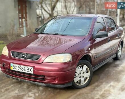 Красный Опель Астра, объемом двигателя 1.4 л и пробегом 250 тыс. км за 2400 $, фото 1 на Automoto.ua