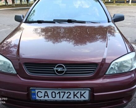Красный Опель Астра, объемом двигателя 1.4 л и пробегом 144 тыс. км за 3650 $, фото 1 на Automoto.ua