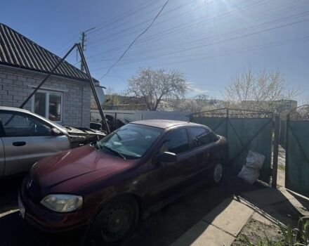 Красный Опель Астра, объемом двигателя 1.4 л и пробегом 400 тыс. км за 1400 $, фото 1 на Automoto.ua