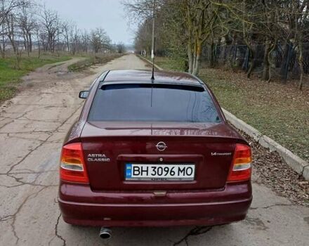 Красный Опель Астра, объемом двигателя 1.4 л и пробегом 170 тыс. км за 3300 $, фото 1 на Automoto.ua