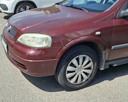 Красный Опель Астра, объемом двигателя 1.39 л и пробегом 121 тыс. км за 3700 $, фото 1 на Automoto.ua