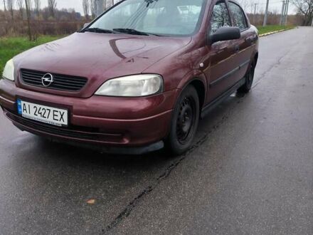 Красный Опель Астра, объемом двигателя 1.36 л и пробегом 327 тыс. км за 2900 $, фото 1 на Automoto.ua