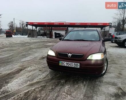 Красный Опель Астра, объемом двигателя 1.4 л и пробегом 319 тыс. км за 2999 $, фото 1 на Automoto.ua