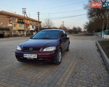 Красный Опель Астра, объемом двигателя 1.36 л и пробегом 198 тыс. км за 2850 $, фото 1 на Automoto.ua